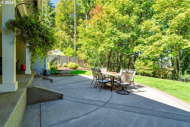 view of patio featuring outdoor dining space and a fenced backyard