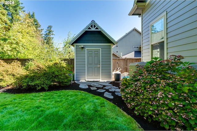 view of shed featuring fence