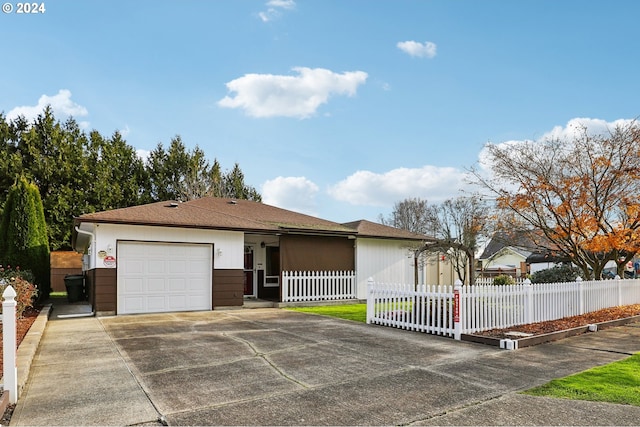 ranch-style home featuring a garage