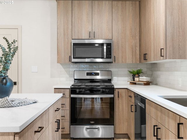 kitchen featuring light countertops, light brown cabinets, backsplash, and stainless steel appliances