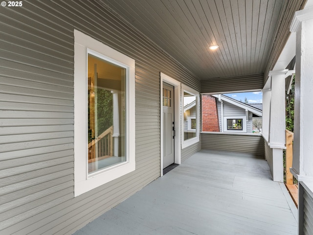 sunroom with wooden ceiling