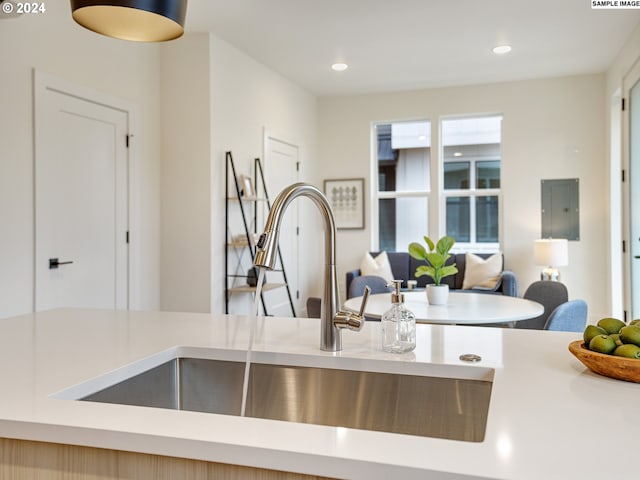 kitchen with light brown cabinets and sink