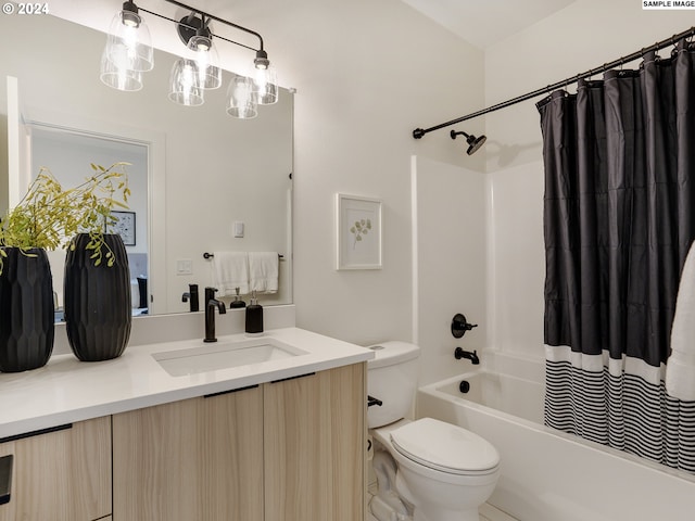 full bathroom featuring vanity, toilet, and shower / bath combination with curtain