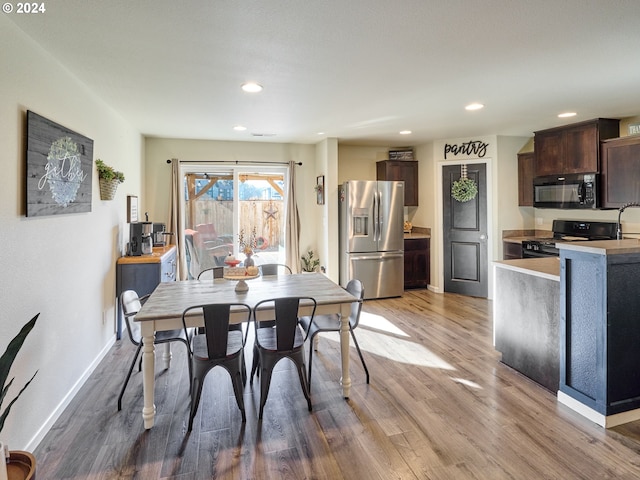 dining area with light hardwood / wood-style flooring