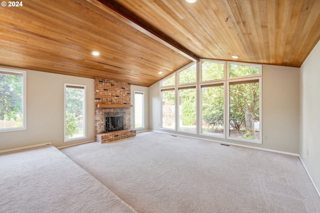 unfurnished living room featuring wooden ceiling, a brick fireplace, vaulted ceiling with beams, and carpet