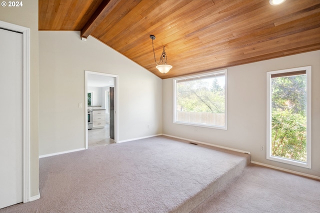 carpeted spare room with wood ceiling and vaulted ceiling with beams