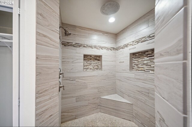 bathroom with a tile shower