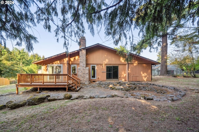 back of house with a wooden deck