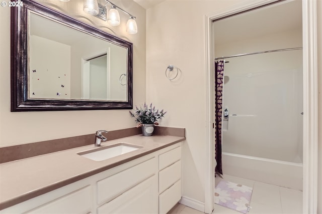 bathroom featuring tile patterned floors, toilet, and vanity