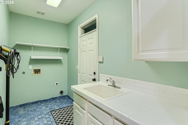 bathroom with vanity and tile patterned flooring