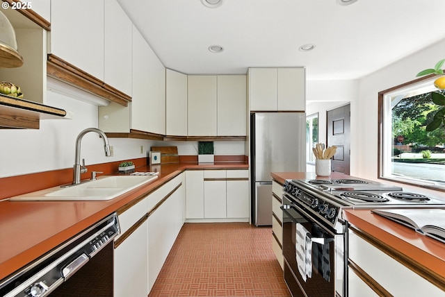 160 Beatrice Ave, Gladstone, OR 97027 - kitchen with electric range oven, dishwashing machine, white cabinets, freestanding refrigerator, and recessed lighting