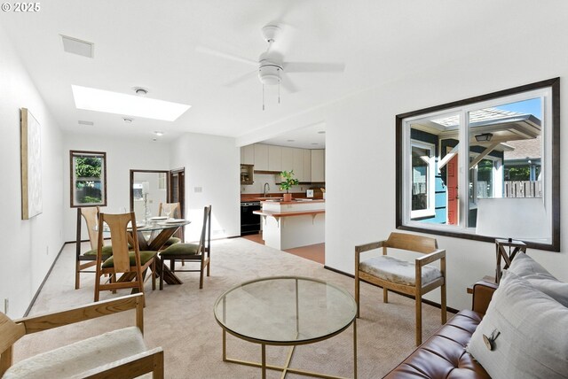 160 Beatrice Ave, Gladstone, OR 97027 - living room with light carpet, a skylight, and ceiling fan