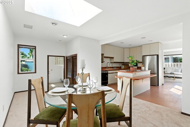 160 Beatrice Ave, Gladstone, OR 97027 - dining space with light colored carpet and a skylight