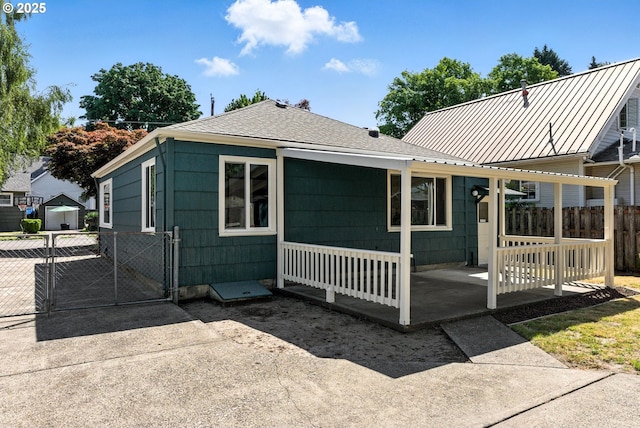 160 Beatrice Ave, Gladstone, OR 97027 - back of property with a gate, roof with shingles, and a metal roof