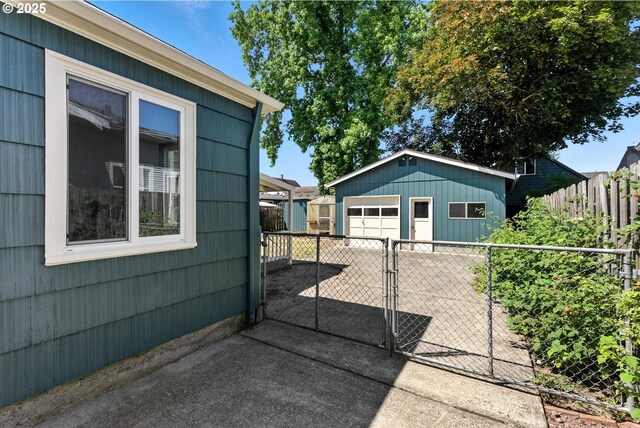 160 Beatrice Ave, Gladstone, OR 97027 - view of side of property with a detached garage, an outdoor structure, and a gate