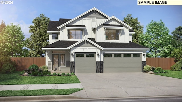 view of front of house featuring a front yard and a garage