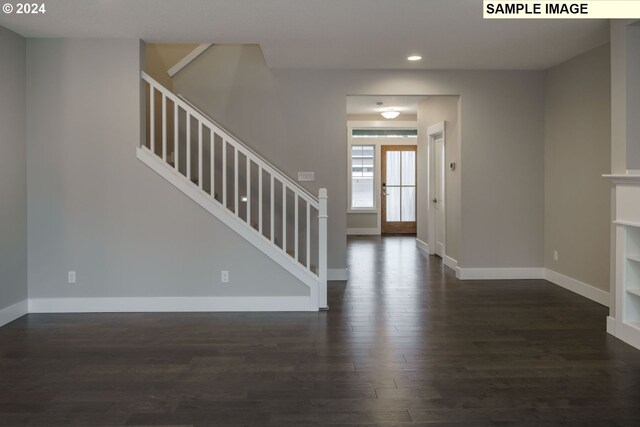 foyer entrance with dark hardwood / wood-style floors