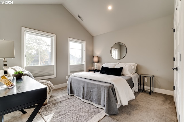 carpeted bedroom featuring vaulted ceiling