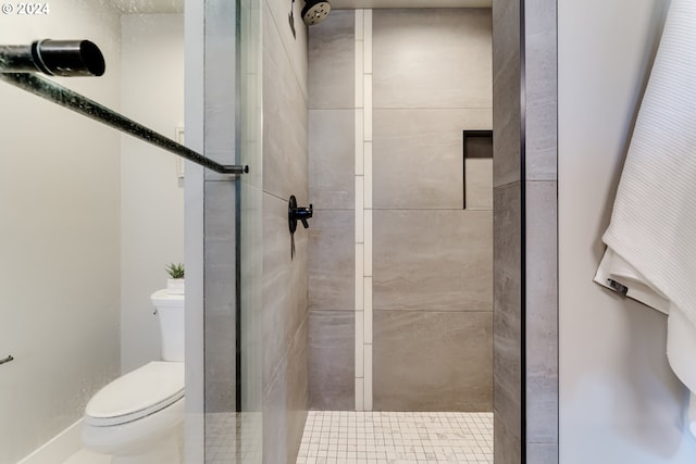 bathroom featuring toilet and walk in shower