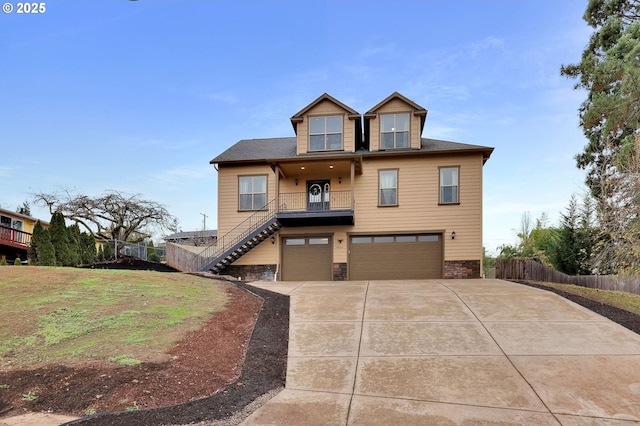 view of front of home featuring a garage and a front yard