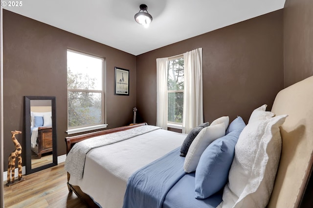 bedroom with light hardwood / wood-style floors