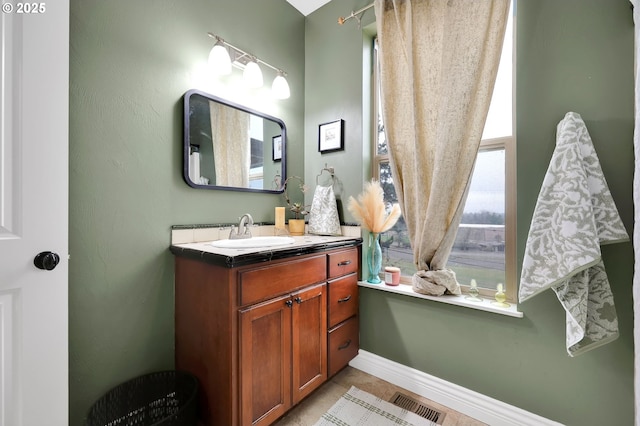 bathroom with vanity and tile patterned floors