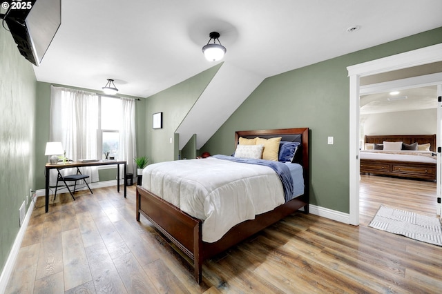 bedroom featuring hardwood / wood-style flooring