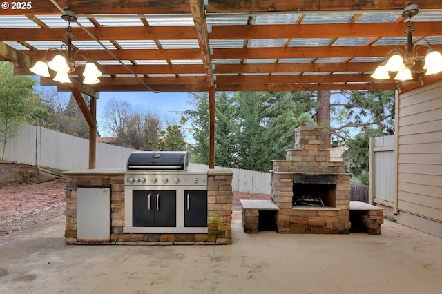 view of patio featuring an outdoor kitchen, a grill, an outdoor stone fireplace, and a pergola