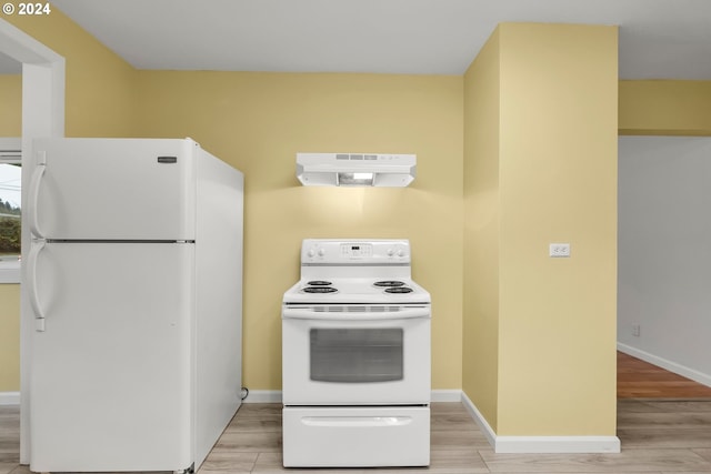 kitchen with white appliances, range hood, and light hardwood / wood-style flooring