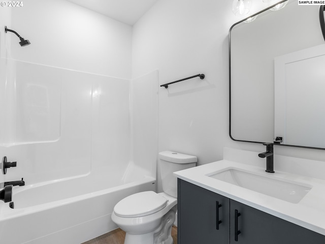 full bathroom featuring hardwood / wood-style flooring, shower / washtub combination, vanity, and toilet