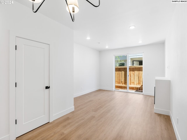 spare room featuring light wood-type flooring