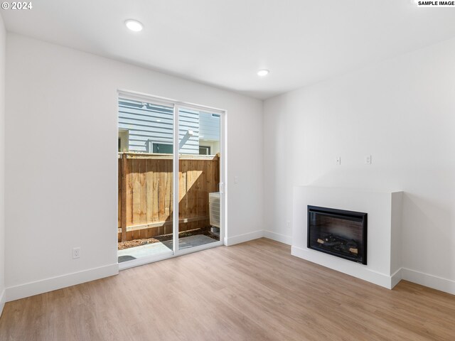 unfurnished living room featuring light hardwood / wood-style flooring