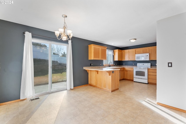 kitchen with an inviting chandelier, a kitchen breakfast bar, kitchen peninsula, pendant lighting, and white appliances