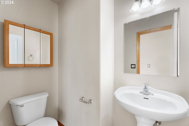 bathroom featuring sink and toilet