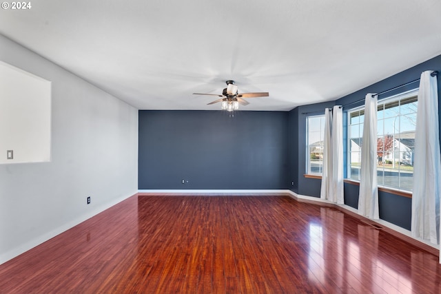 spare room featuring ceiling fan and hardwood / wood-style flooring