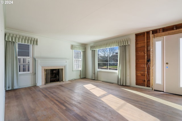 unfurnished living room with hardwood / wood-style flooring