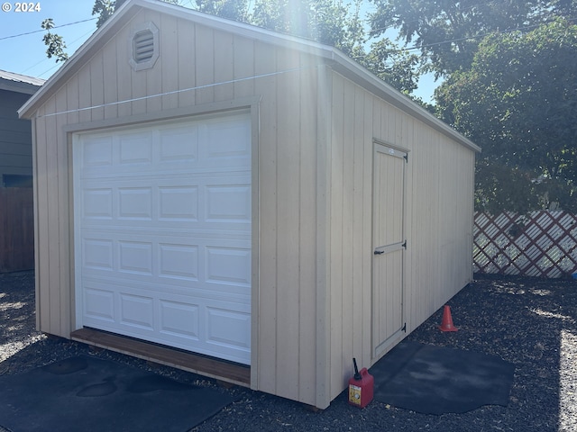 garage featuring wooden walls