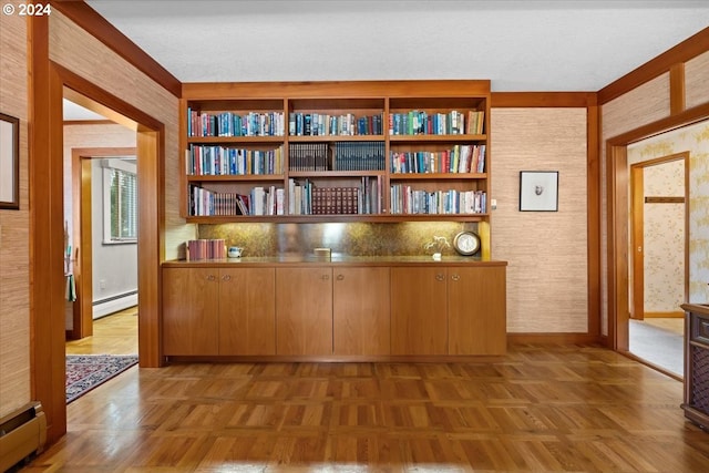 interior space featuring light parquet floors and baseboard heating