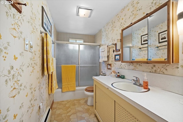 full bathroom with a baseboard heating unit, bath / shower combo with glass door, toilet, vanity, and tile patterned floors