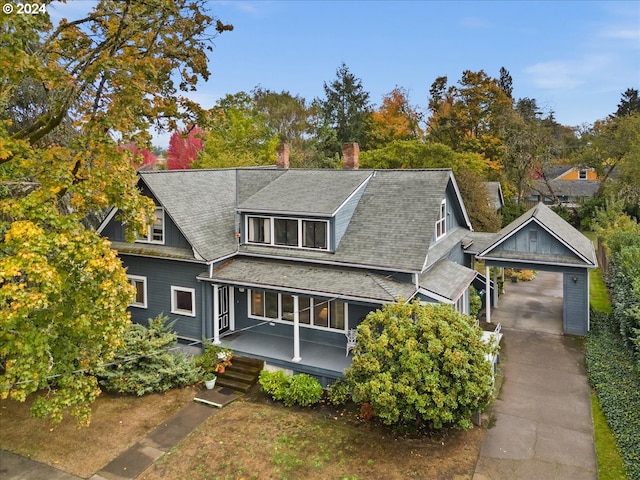 view of front of home featuring a porch and a garage