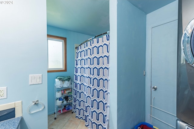 bathroom featuring curtained shower and tile patterned floors