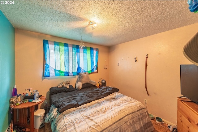 bedroom featuring a textured ceiling