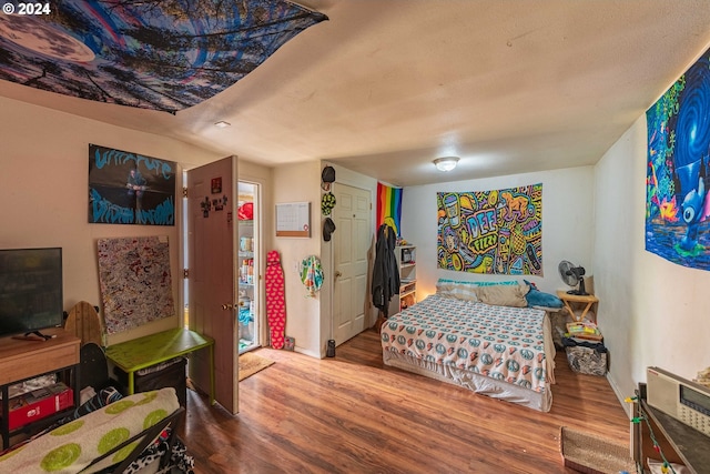 bedroom featuring hardwood / wood-style flooring