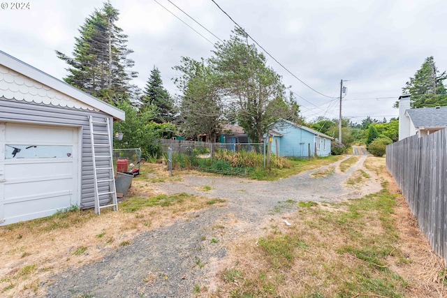 view of yard featuring a garage