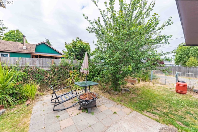 view of patio / terrace featuring a fire pit