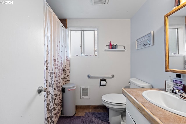 2051 N Park Ave, Eugene, OR 97404 - full bath with toilet, heating unit, tile patterned flooring, vanity, and a shower with curtain