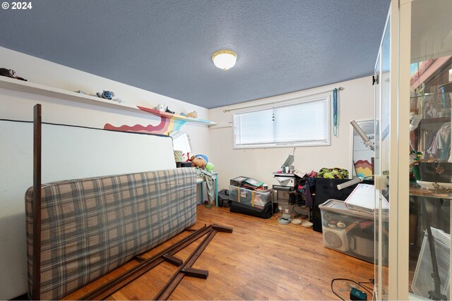 2051 N Park Ave, Eugene, OR 97404 - bedroom featuring wood finished floors and a textured ceiling