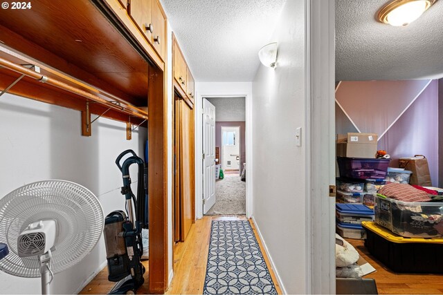 2051 N Park Ave, Eugene, OR 97404 - corridor featuring light wood finished floors, a textured ceiling, and baseboards