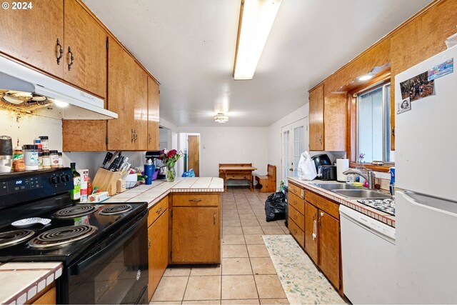 2051 N Park Ave, Eugene, OR 97404 - kitchen featuring white appliances, a sink, under cabinet range hood, tile counters, and brown cabinets
