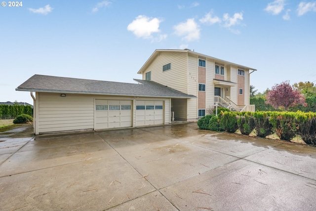 view of side of home with a garage